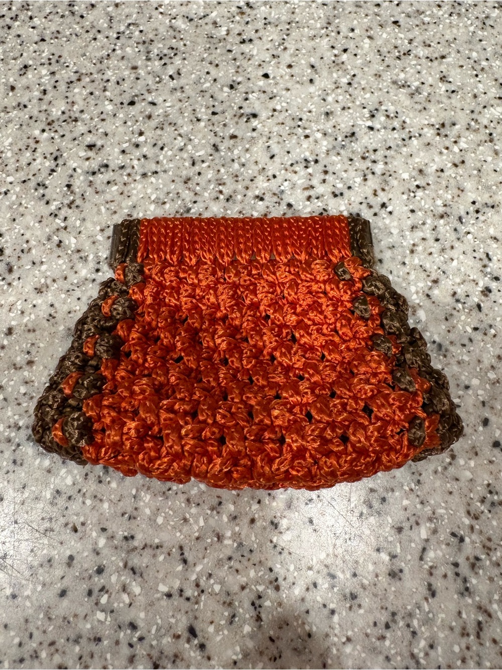 Handmade rust-orange and brown crocheted frame clutch